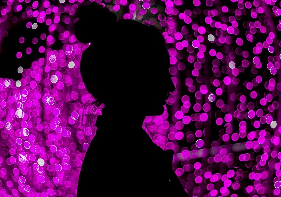 Silhouette with dots in the background